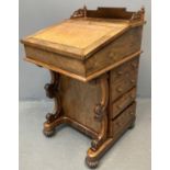 Victorian rosewood Davenport desk, the fretwork gallery above unusual sliding slope front mechanism,