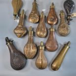 Interesting collection of 18th and 19th century brass and other metal powder and shot flasks, all