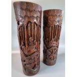 Pair of Chinese bamboo brush pots, overall carved with figures within a landscape and boats. 38cm