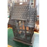Unusual carved wooden bird cage with dummy bird. (B.P. 21% + VAT)