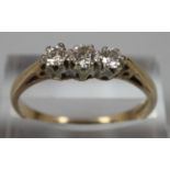 9ct gold three stone diamond ring. Size P. 2.3g approx. (B.P. 21% + VAT)