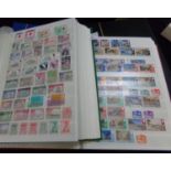 All World mint and used collection of stamps in four large stockbooks. Good range of countries, many