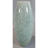 A heavy possibly oriental crackled celadon glazed vase of ovoid form. 23cm high approx. (B.P.