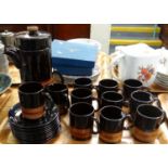 Twenty two piece dark brown glazed mid Century coffee set. (B.P. 21% + VAT)