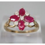 9ct gold white and red stone flowerhead ring. Size O1/2. 2.9g approx. (B.P. 21% + VAT)