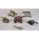 Collection of miniature ship's type cannons, of slightly differing forms, with metal barrels and
