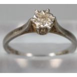 18ct white gold white stone solitaire ring. Size M. 2.5g approx. (does not test as a diamond). (B.P.