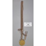 9ct gold curb link T bar chain with gold Guinea coin. 44.5g approx. (B.P. 21% + VAT)