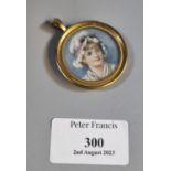 Hand painted portrait pendant of a young girl in bonnet. Gilt metal frame. (B.P. 21% + VAT)