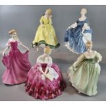 Five Royal Doulton bone china figurines, to include: 'Victoria', 'In Vogue Emma', 'Hillary', Fair