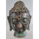 Small bronze Buddha head. 10.5cm high approx. (B.P. 21% + VAT)