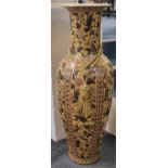 Large oriental design pottery floor vase decorated with flowers and foliage on a mustard ground.