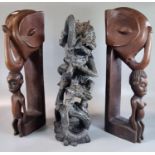 Hardwood sculpture of Hanuman and Naga, together with a pair of carved hardwood bookends with