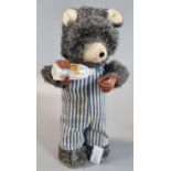 Clockwork automaton toy in the form of a bear with bottle. 19cm high approx, (B.P. 21% + VAT)