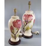 Two similar Moorcroft pottery tube lined Magnolia design table lamps. The tallest 34cm approx. (