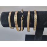 Collection of 9ct gold and rolled gold bangles. (B.P. 21% + VAT)