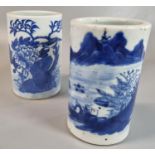 Two Chinese blue and white porcelain brush holders (bitongs), one depicting a fisherman and a