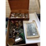 Wooden box of assorted tokens: bus tokens, National Transport tokens, poker chips etc. together with