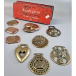 Vintage Elastoplast tin containing a collection of antique horse brasses and copper plaques. (B.P.
