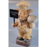 Novelty butcher's shop advertising pig holding a sign. 64cm high approx. (B.P. 21% + VAT)