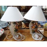 A pair of Gwili pottery floral design table lamps with fabric shades. (2) (B.P. 21% + VAT)