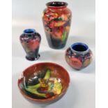 Collection of Moorcroft pottery tube lined items to include: vases and small bowl, pomegranate and
