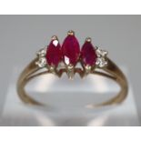 9ct gold diamond red stone dress ring. Size M. 1.8g approx. (B.P. 21% + VAT)
