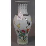 Chinese porcelain baluster vase depicting a bird on a yellow flowered branch, with other blooms