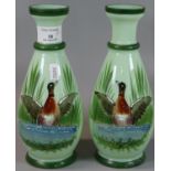 Pair of Victorian opaline green glass vases, hand painted with ducks in a lake with reeds. 22cm high