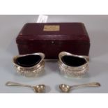 Leather cased set of Edwardian silver salts with spoons and blue liners. Birmingham hallmarks. The