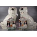 Pair of early 20th Century Staffordshire fireside seated Spaniels, together with a pair of 19th