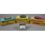 Dinky toys 174 Hudson Hornet sedan, together with a Dinky toys 180 Packard Clipper sedan and another