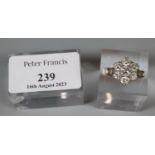 Seven stone diamond cluster ring set in 18ct white gold. Total diamond weight 1.45cts. Size M. 4.