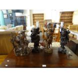Mixed group of Oriental carved wood items, three converted to table lamps to include: study of a