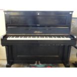 Late 19th/early 20th century Bluthner ebonised case upright grand piano, having cast frame with