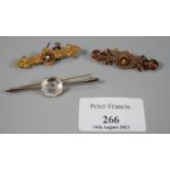 Two Victorian 9ct gold brooches 7.5g approx., together with a 15ct gold pin brooch with large