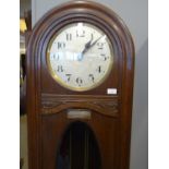 Early 20th century oak presentation clock with silvered face and solid silver plaque dated 1930 with