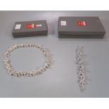 Two piece matching contemporary design ladies necklace and bracelet, the boxes both marked 'Silver