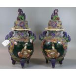 A pair of Japanese Moriaje enamel decorated tripod vases and covers. 35cm high approx. (B.P. 21% +