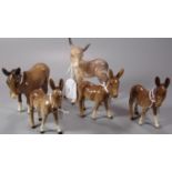 A collection of Beswick donkeys. (5) (B.P. 21% + VAT)