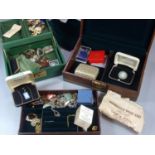 Two jewellery boxes comprising assorted costume jewellery, to include: brooches, clip-on earrings,