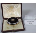 Victorian gold and hard stone mourning brooch, the reverse with text, the front with central star