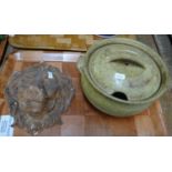 Tray containing a lidded stoneware pot or casserole and a lion head plaster of paris wall
