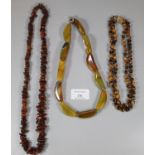 Three hardstone necklaces to include tiger's eye and others. (B.P. 21% + VAT)