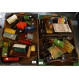 Two boxes of vintage Hornby tinplate O gauge trains, rolling stock and other items, to include:
