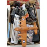 Box of assorted items to include: various binoculars, rustic wooden model of an RAF Aeroplane,