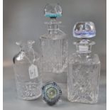 Pair of cut lead crystal square section spirit decanters with caned stoppers together with another