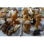 Two trays of carved wooden figures, to include: various birds, cockerel, parrot, owl, camel,