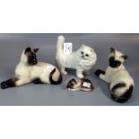 Four animal figures, a Beswick and a Royal Doulton: Siamese Cat, Beswick white Persian Cat and a