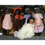 Box of dolls with moveable limbs: doll in a wedding dress, black baby dolls with homemade clothes,